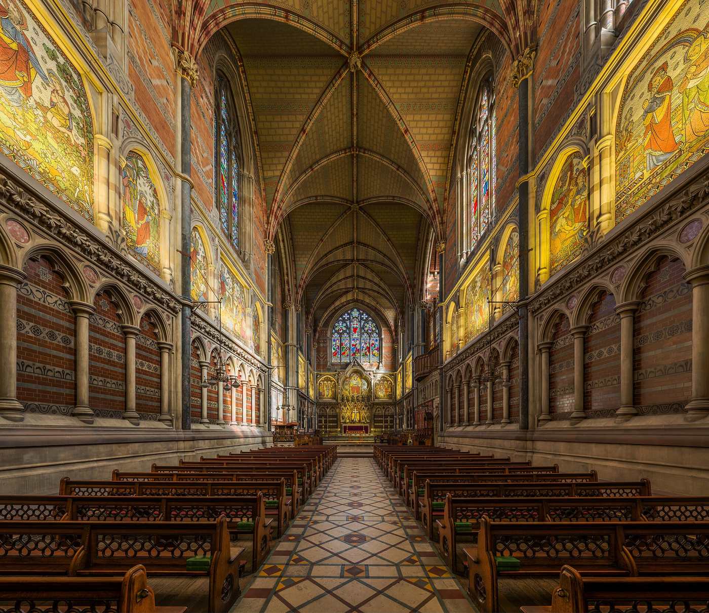 The painted and tiled interior of Keble College Chapel