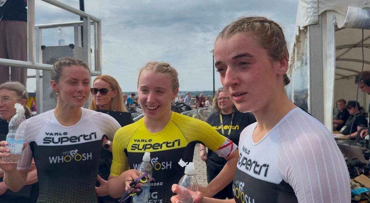 Three professional triathletes in Supertri race suits after the finish on Jersey